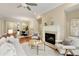 Open floor plan showcasing living room and dining room with a fireplace at 385 Windy Pines Trl, Roswell, GA 30075