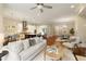 Bright and spacious living space with kitchen island and cozy seating area at 385 Windy Pines Trl, Roswell, GA 30075