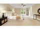 Spacious main bedroom with carpet, french doors, and ensuite access at 385 Windy Pines Trl, Roswell, GA 30075