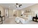 Bright main bedroom with a ceiling fan, furniture, and decor at 385 Windy Pines Trl, Roswell, GA 30075