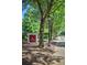Outdoor signage featuring restaurant Osteria Mattone, with lush foliage and sidewalk in view at 385 Windy Pines Trl, Roswell, GA 30075