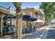 Outdoor dining at Ceviche bar and restaurant with umbrellas on Canton street at 385 Windy Pines Trl, Roswell, GA 30075