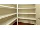 Walk-in pantry with white shelving at 385 Windy Pines Trl, Roswell, GA 30075