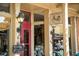A quaint restaurant entrance featuring vintage lighting, signage, and a welcoming red door at 385 Windy Pines Trl, Roswell, GA 30075