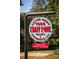 Outdoor signage for Crazy Love Market & Coffeehouse with bright graphics and waffle ad at 385 Windy Pines Trl, Roswell, GA 30075