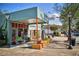 Spruced Art Fashion Lifestyle store exterior in a quaint downtown area with a brick sidewalk at 385 Windy Pines Trl, Roswell, GA 30075