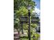 Sign pointing to City Hall, Canton St Shops, Cultural Arts Center and Parking in a lovely neighborhood at 385 Windy Pines Trl, Roswell, GA 30075