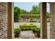 Inviting view from the front porch, showcasing a well-maintained street, lush greenery, and a glimpse of the neighborhood at 385 Windy Pines Trl, Roswell, GA 30075