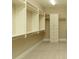 Spacious walk-in closet with custom shelving and ample storage space for clothes and accessories at 385 Windy Pines Trl, Roswell, GA 30075
