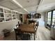Dining room with table and chairs, built-in shelves, wood floors, and tv at 55 Beverly Ne Rd, Atlanta, GA 30309
