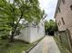 Exterior view of house featuring a deck, white paint, and driveway at 55 Beverly Ne Rd, Atlanta, GA 30309