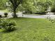 View of a large front yard with street and other homes visible at 55 Beverly Ne Rd, Atlanta, GA 30309
