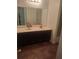 The bathroom features a sleek vanity with ample counter space and dark wood cabinetry at 6449 Pinebark Way, Morrow, GA 30260