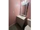 Cozy bathroom featuring stylish vanity with decorative mirror and tile accents at 6449 Pinebark Way, Morrow, GA 30260