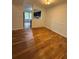 Traditional dining room with view to the kitchen offers hardwood floors and classic wainscoting at 6449 Pinebark Way, Morrow, GA 30260
