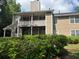 Two-story home featuring siding, a balcony, and a well-manicured lawn at 6449 Pinebark Way, Morrow, GA 30260