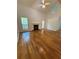 Bright living room has hardwood floors, fireplace, ceiling fan and vaulted ceilings at 6449 Pinebark Way, Morrow, GA 30260