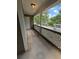 Outdoor patio with white lattice railing and concrete floor, providing an outdoor space at 6449 Pinebark Way, Morrow, GA 30260