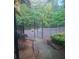 Exterior view of community tennis court enclosed by a black metal fence at 6449 Pinebark Way, Morrow, GA 30260