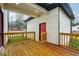 A view of a backyard and deck with a door on the side of the house at 1330 Adams Sw Dr, Atlanta, GA 30311