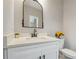 Charming bathroom featuring a stylish mirror, marble countertops, modern fixtures, and plenty of natural light at 1330 Adams Sw Dr, Atlanta, GA 30311