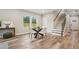 Stylish dining room with modern table, wood floors, and plenty of natural light at 1330 Adams Sw Dr, Atlanta, GA 30311