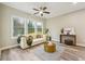 Cozy living room with a stylish sofa, wood floors, and large windows providing ample light at 1330 Adams Sw Dr, Atlanta, GA 30311