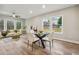 Bright living area with a round glass table, contemporary decor, and warm, natural lighting at 1330 Adams Sw Dr, Atlanta, GA 30311