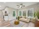 Comfortable living room featuring a plush sofa, decorative pillows, and an abundance of natural light at 1330 Adams Sw Dr, Atlanta, GA 30311