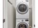 Functional laundry room featuring a stacked washer and dryer unit at 1628 Briarcliff Ne Rd # 15, Atlanta, GA 30306