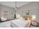 Serene main bedroom boasting a tray ceiling, fan, natural light, and stylish decor at 1628 Briarcliff Ne Rd # 15, Atlanta, GA 30306