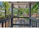 Backyard featuring a fire pit and seating area with a wooden deck and lush greenery at 2705 Osborne Ne Rd, Brookhaven, GA 30319