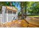 Backyard shed and deck area, perfect for storage or entertaining at 2705 Osborne Ne Rd, Brookhaven, GA 30319