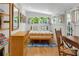 Sunny bedroom featuring french doors, a bed with stylish bedding, and hardwood floors at 2705 Osborne Ne Rd, Brookhaven, GA 30319