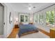 Well-lit bedroom with three large windows offering a serene outdoor view at 2705 Osborne Ne Rd, Brookhaven, GA 30319