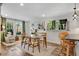 Bright dining area with large windows, stylish lighting, and seating for Gathering meals at 2705 Osborne Ne Rd, Brookhaven, GA 30319