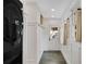 Bright mudroom featuring a washer/dryer, convenient hooks, and a slate floor at 2705 Osborne Ne Rd, Brookhaven, GA 30319
