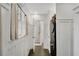 Stylish mudroom features laundry setup, wainscoting, and access to a shower at 2705 Osborne Ne Rd, Brookhaven, GA 30319
