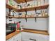 Walk-in pantry featuring custom wood shelves and a convenient countertop at 2705 Osborne Ne Rd, Brookhaven, GA 30319