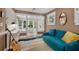 Inviting living room features a blue couch, stylish rug, and natural light at 2705 Osborne Ne Rd, Brookhaven, GA 30319