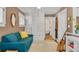 Relaxing sitting room with blue couch, storage, and entryway to bathroom at 2705 Osborne Ne Rd, Brookhaven, GA 30319