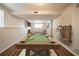 Spacious basement with a pool table, TV, and comfortable seating area with fireplace at 6082 Raintree Bnd, Lithonia, GA 30058