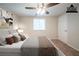 Relaxing bedroom with a plush bed, soft carpet, ceiling fan and natural light from the window at 6082 Raintree Bnd, Lithonia, GA 30058