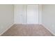 Bedroom with neutral walls, carpet, and a closet; perfect for creating a personalized space at 6082 Raintree Bnd, Lithonia, GA 30058