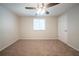 Bright bedroom with plush carpet and ample natural light from a large window at 6082 Raintree Bnd, Lithonia, GA 30058