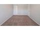 Bedroom with neutral walls, carpet, and a closet; perfect for creating a personalized space at 6082 Raintree Bnd, Lithonia, GA 30058