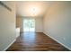 Dining room with vaulted ceiling, hardwood floors, and sliding glass doors at 6082 Raintree Bnd, Lithonia, GA 30058