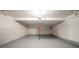 Two-car garage with painted floors and center beam support at 6082 Raintree Bnd, Lithonia, GA 30058