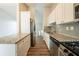 Modern kitchen featuring white cabinets, stainless steel appliances, and granite countertops at 6082 Raintree Bnd, Lithonia, GA 30058