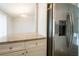 Kitchen island with granite countertop paired with a stainless steel refrigerator at 6082 Raintree Bnd, Lithonia, GA 30058